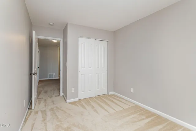 an empty room with a bathroom