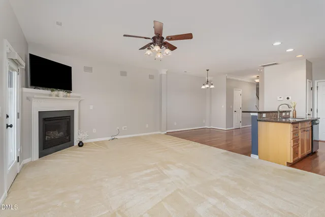 a view of an empty room with a fireplace