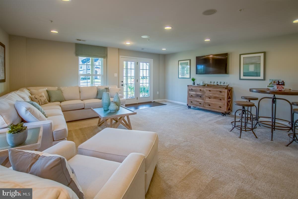 7915 Mine Run Road Hanover, MD 21076 - Photo 20 of 30 a living room with furniture and a flat screen tv