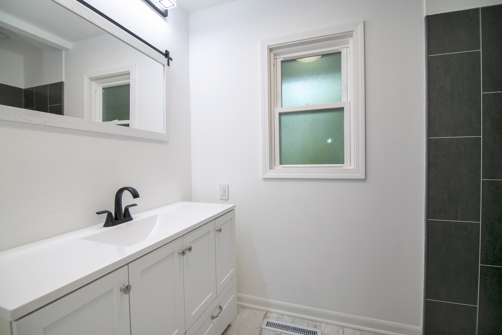 22 Erin Lane Kankakee, IL 60901 - Photo 21 of 45 a bathroom with a sink and mirror