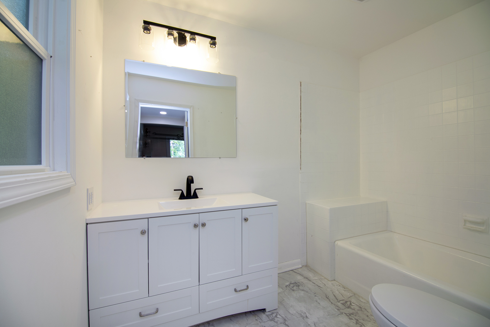 22 Erin Lane Kankakee, IL 60901 - Photo 26 of 45 a bathroom with a sink a toilet and a bathtub