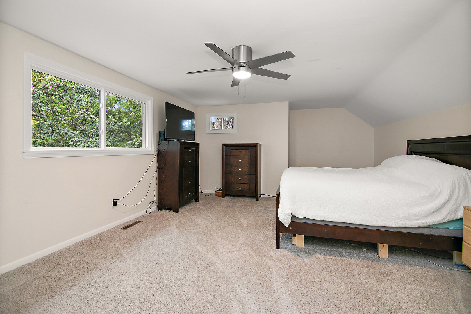 22 Erin Lane Kankakee, IL 60901 - Photo 28 of 45 a spacious bedroom with a bed and a ceiling fan