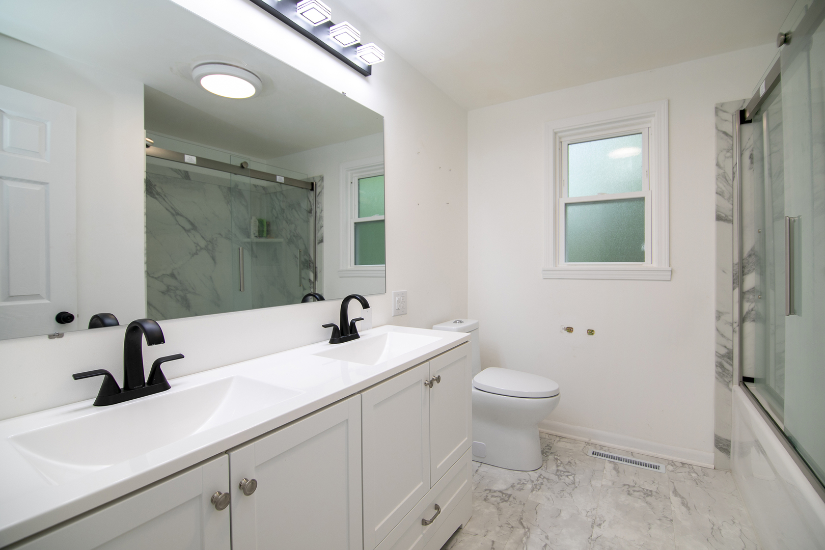 22 Erin Lane Kankakee, IL 60901 - Photo 29 of 45 a bathroom with a sink and a mirror