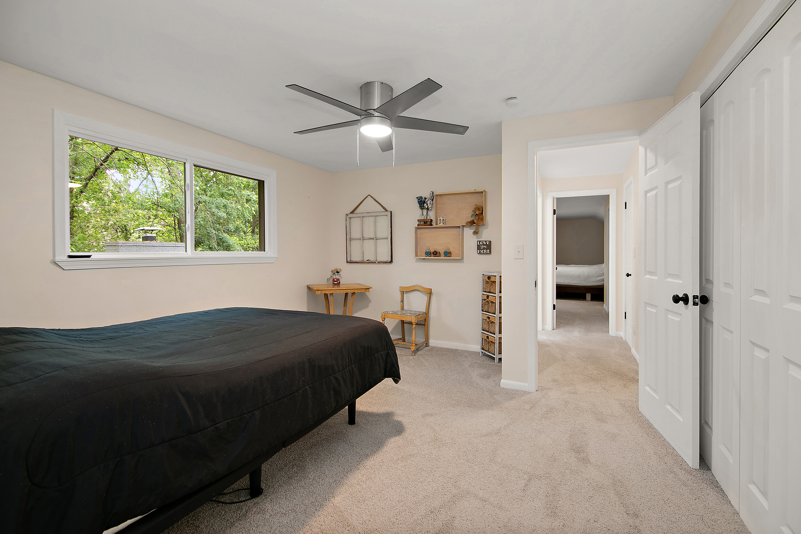 22 Erin Lane Kankakee, IL 60901 - Photo 30 of 45 a bedroom with a bed and a chandelier