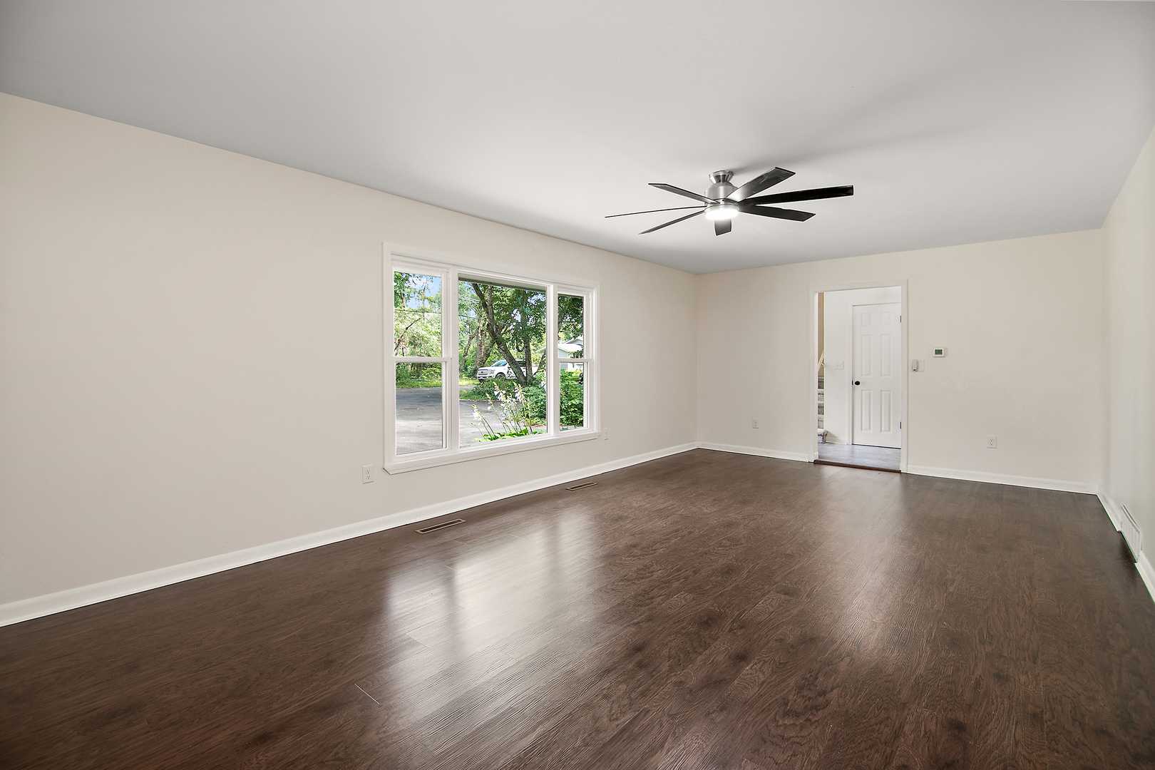 22 Erin Lane Kankakee, IL 60901 - Photo 10 of 45 a view of an empty room with wooden floor and a window