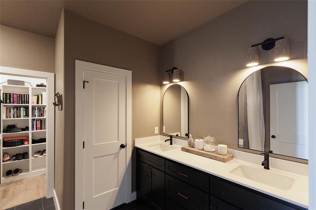500 County Road 2745 Decatur, TX 76234 - Photo 17 of 38 a bathroom with a double vanity sink and a mirror