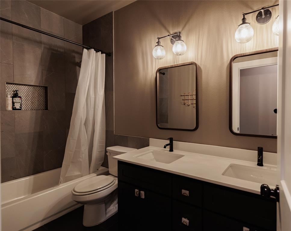 500 County Road 2745 Decatur, TX 76234 - Photo 23 of 38 a bathroom with a double vanity sink and a mirror