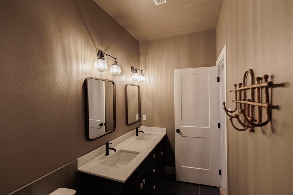 500 County Road 2745 Decatur, TX 76234 - Photo 24 of 38 a bathroom with a sink and a mirror