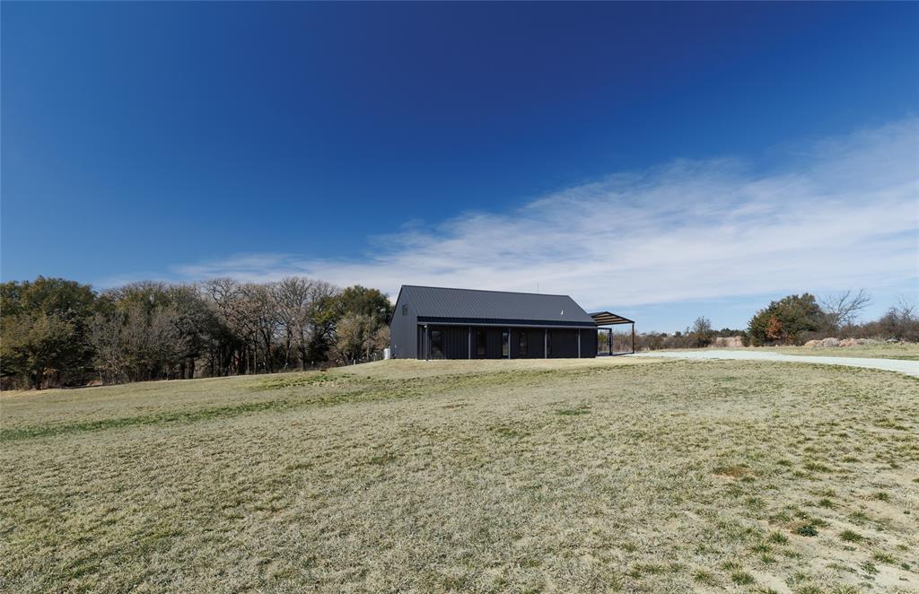 500 County Road 2745 Decatur, TX 76234 - Photo 4 of 38 a big house with big yard and large trees