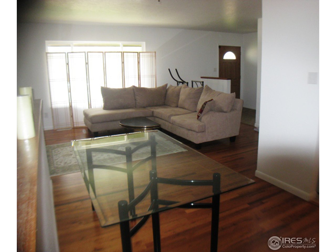 3314 West 5th St Road Greeley, CO 80634 - Photo 2 of 15 Living area with hardwood floors