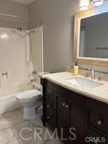 a bathroom with a sink a toilet and a bathtub