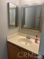 915 South Ridgecrest Circle Anaheim, CA 92807 - Photo 6 of 21 a bathroom with a sink and a mirror