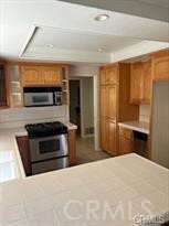 915 South Ridgecrest Circle Anaheim, CA 92807 - Photo 9 of 21 a bedroom with a bed and a television