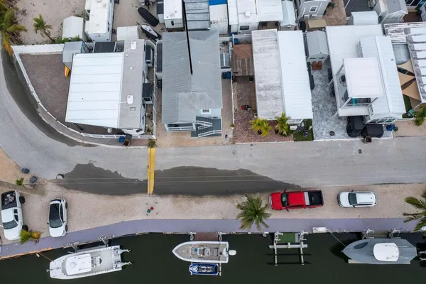 an aerial view of houses with outdoor space