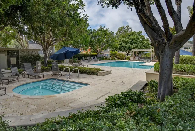 a view of a backyard with plants and a patio
