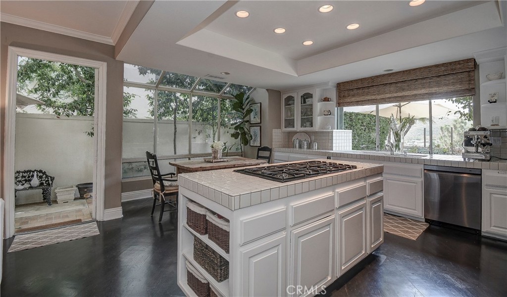 33 Hastings Laguna Niguel, CA 92677 - Photo 7 of 17 a kitchen with a stove and a wooden floor