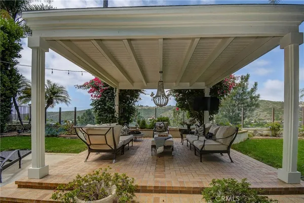 a building outdoor space with patio furniture and potted plants