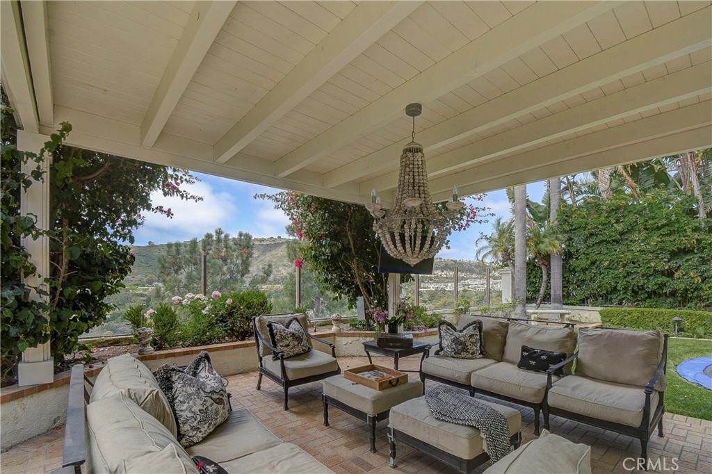 33 Hastings Laguna Niguel, CA 92677 - Photo 9 of 17 a living room with patio fireplace furniture and a large window