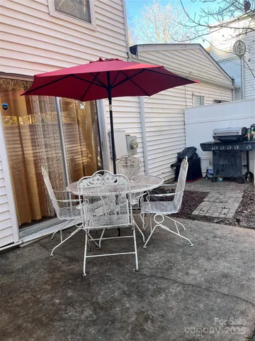 a view of a two chairs in the backyard