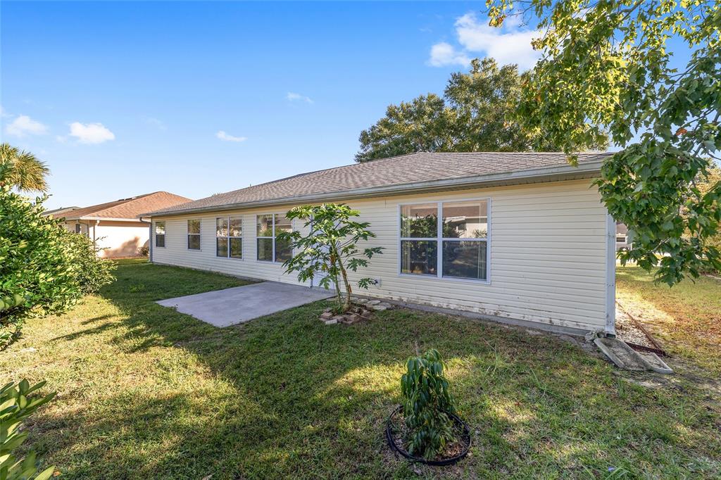 6241 Southwest 84th Place Ocala, FL 34476 - Photo 26 of 33 a front view of a house with a yard