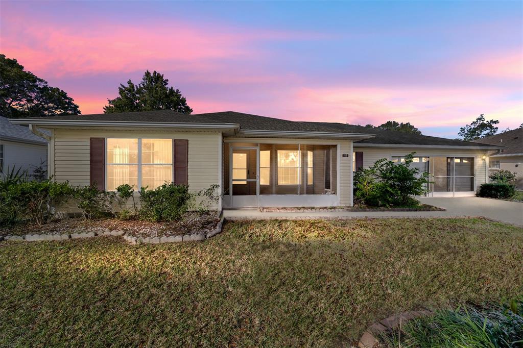 6241 Southwest 84th Place Ocala, FL 34476 - Photo 3 of 33 a front view of a house with a yard