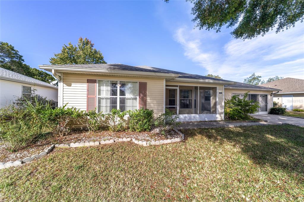 6241 Southwest 84th Place Ocala, FL 34476 - Photo 31 of 33 front view of a house with a yard