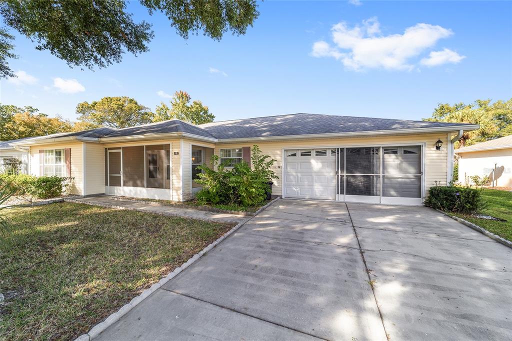 6241 Southwest 84th Place Ocala, FL 34476 - Photo 32 of 33 a front view of a house with garden