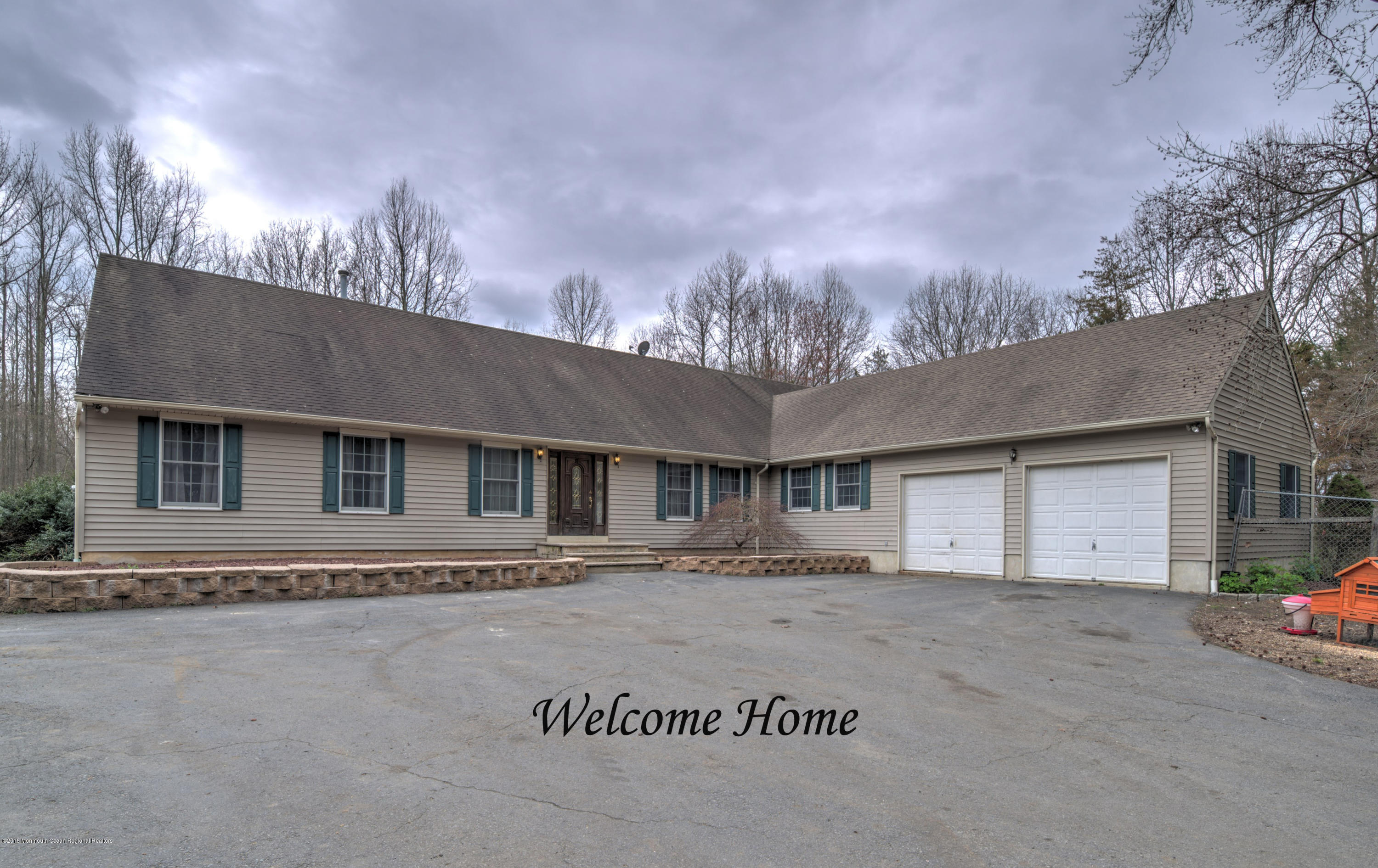 20 Hornerstown Road Cream Ridge, NJ 08514 - Photo 1 of 28 a front view of a house with a yard and garage