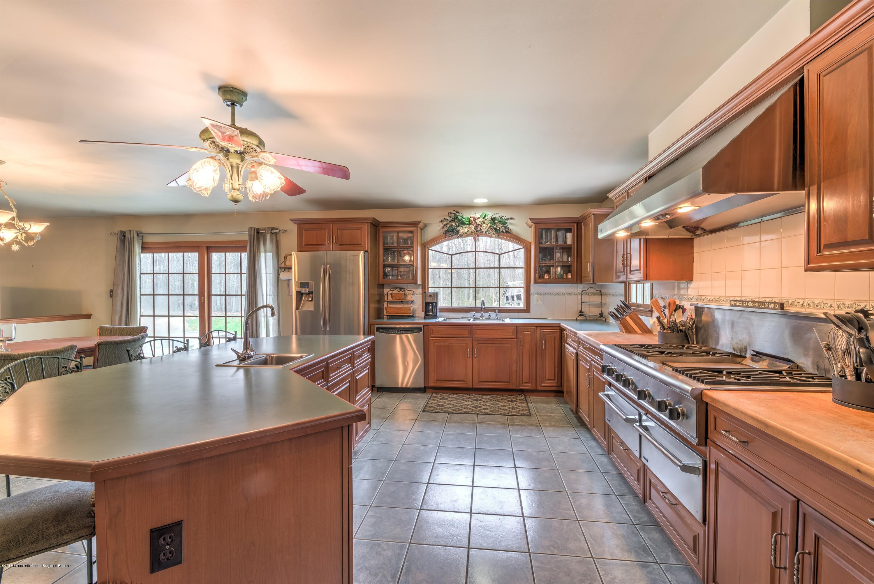 20 Hornerstown Road Cream Ridge, NJ 08514 - Photo 11 of 28 a kitchen with stainless steel appliances granite countertop a sink counter space cabinets and a stove