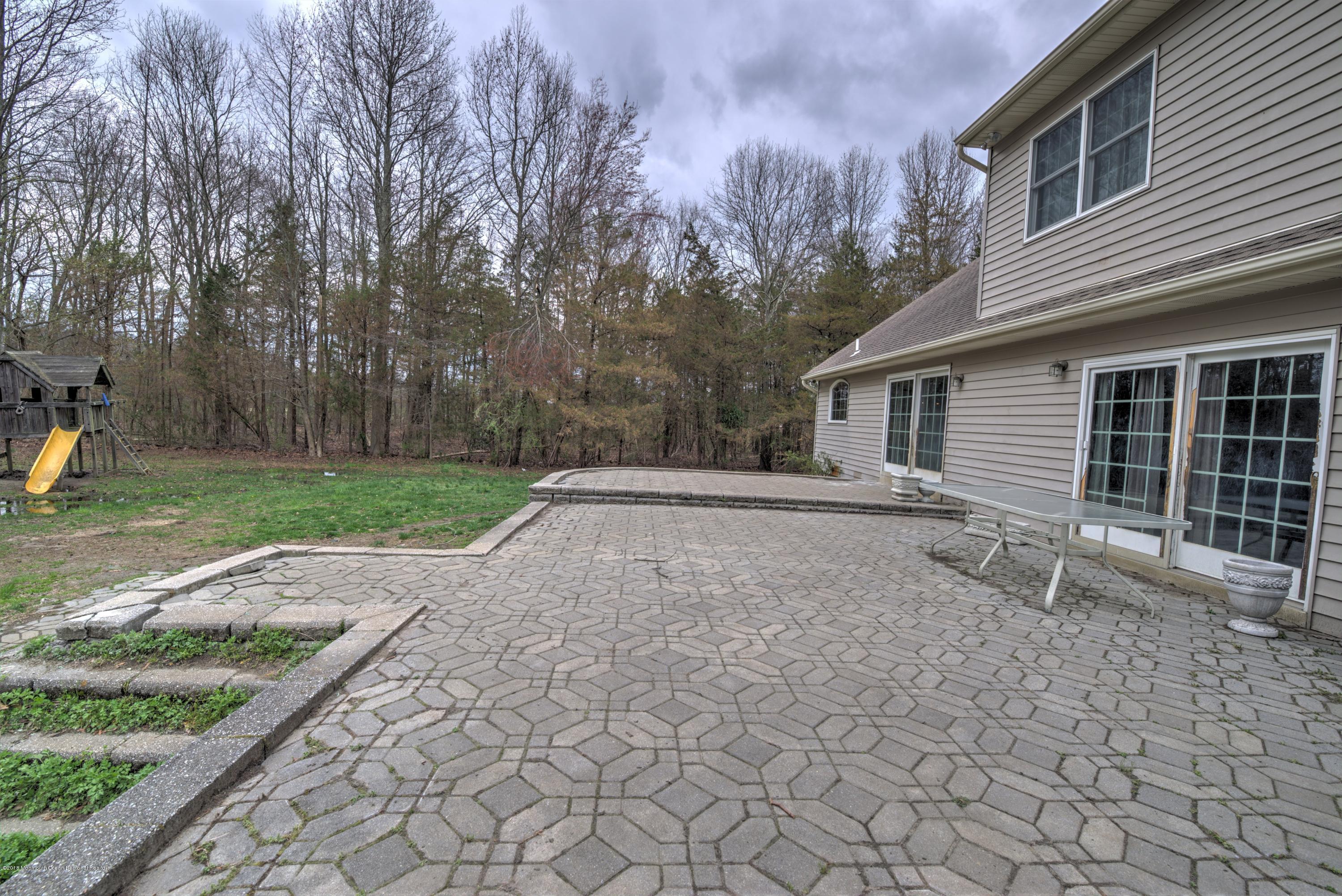 20 Hornerstown Road Cream Ridge, NJ 08514 - Photo 25 of 28 a view of a house with backyard and trees