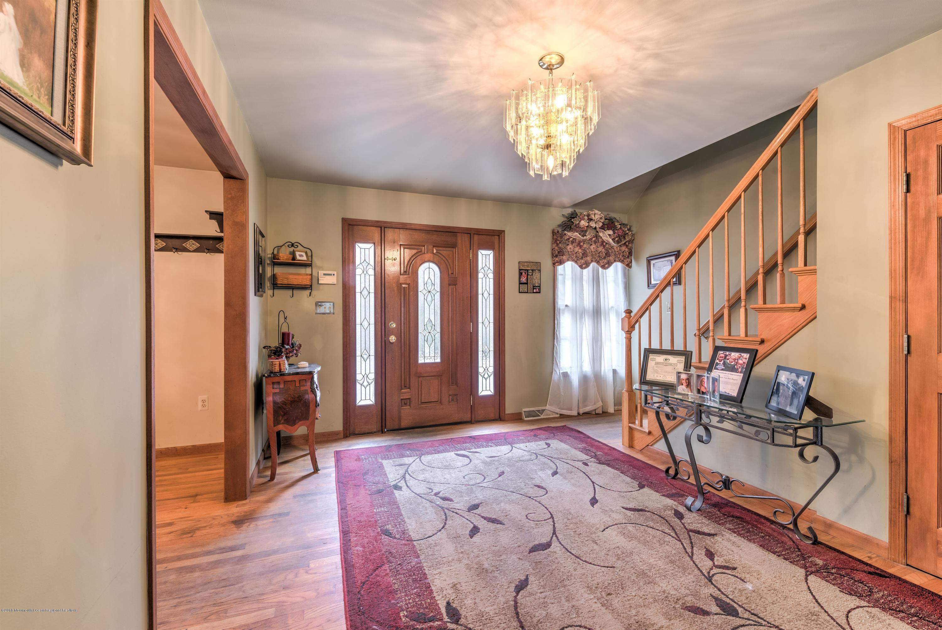 20 Hornerstown Road Cream Ridge, NJ 08514 - Photo 3 of 28 a view of entryway with a chandelier