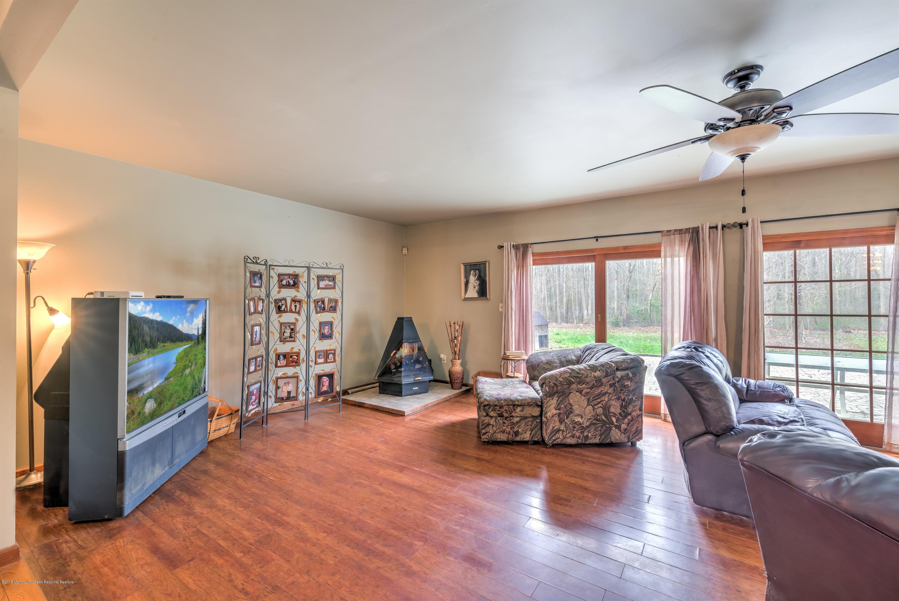 20 Hornerstown Road Cream Ridge, NJ 08514 - Photo 4 of 28 a living room with furniture and a flat screen tv