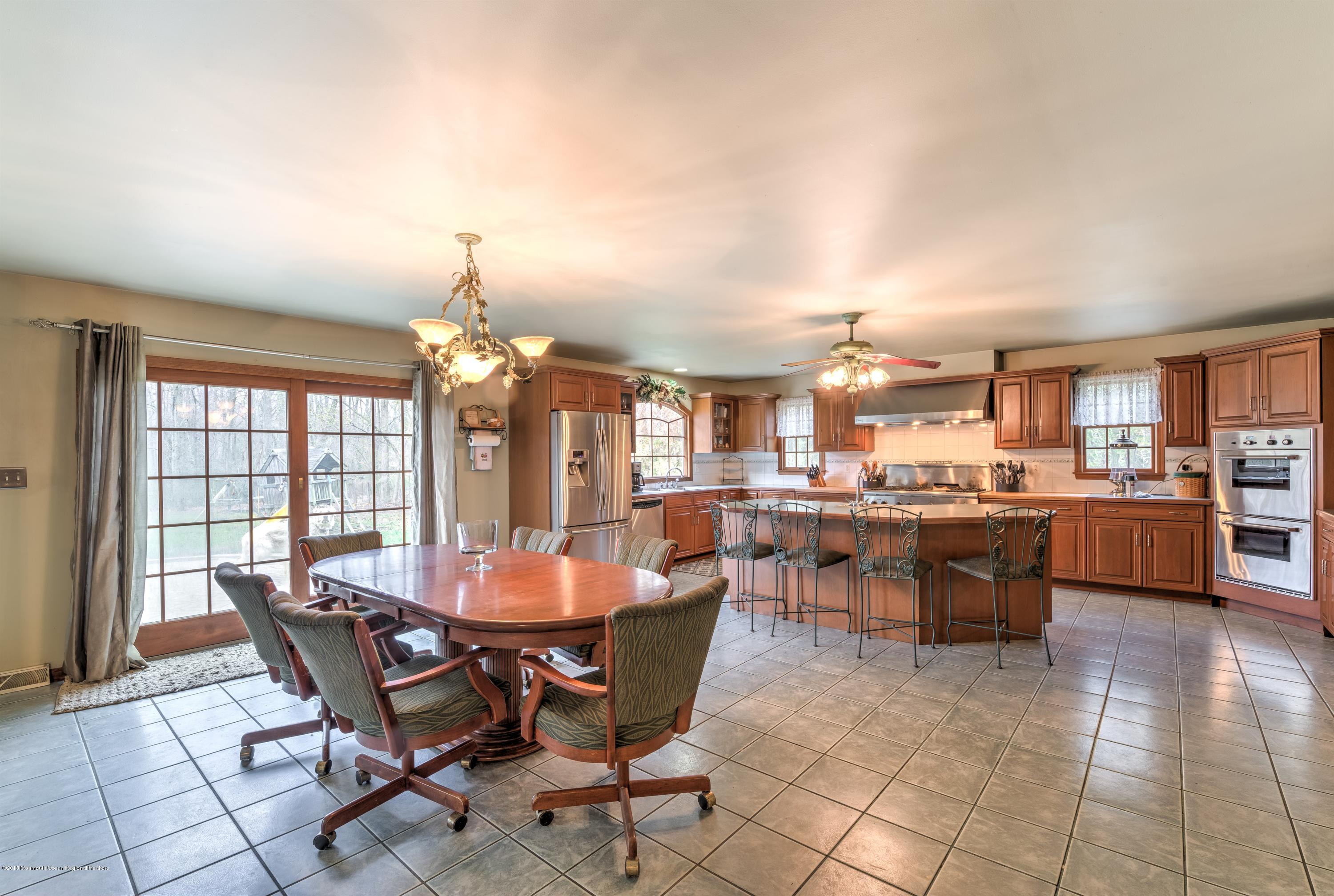 20 Hornerstown Road Cream Ridge, NJ 08514 - Photo 8 of 28 a view of a dining room with furniture and chandelier
