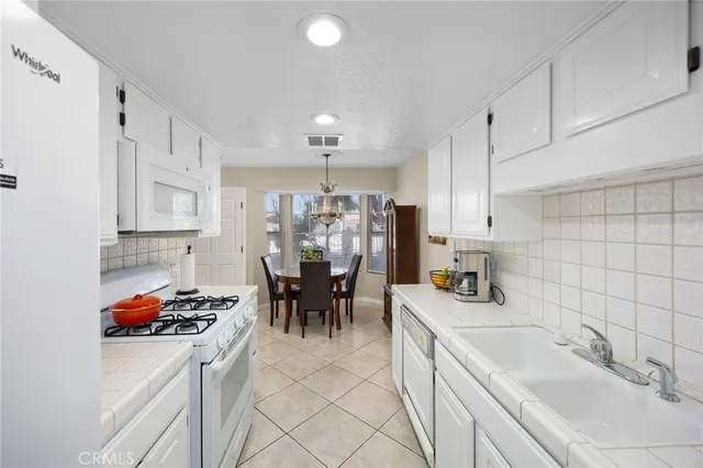 a kitchen that has a sink cabinets and counter space