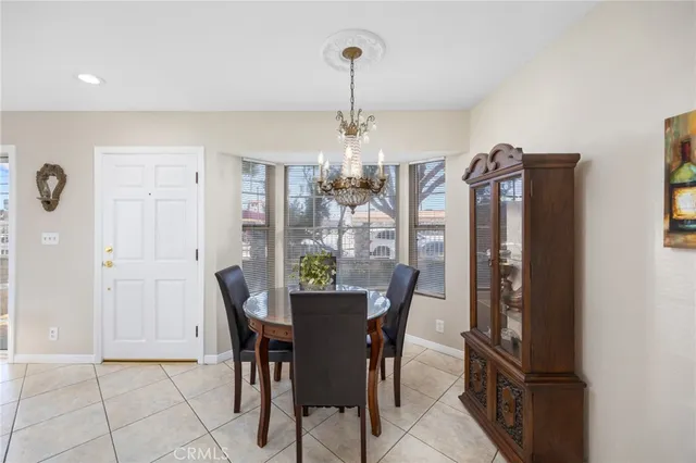 a view of a dining room with furniture and window