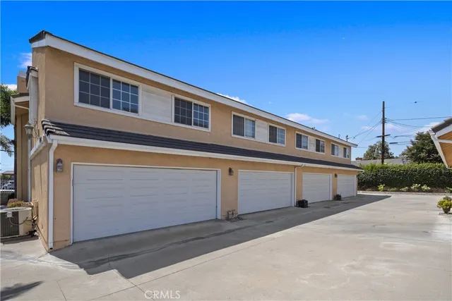 a front view of a house with a garage