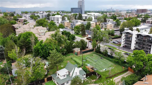 an aerial view of multiple houses with yard
