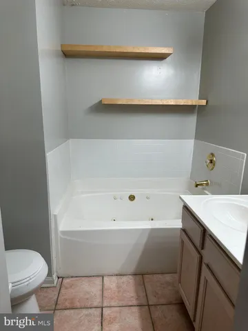 a bathroom with a sink and toilet