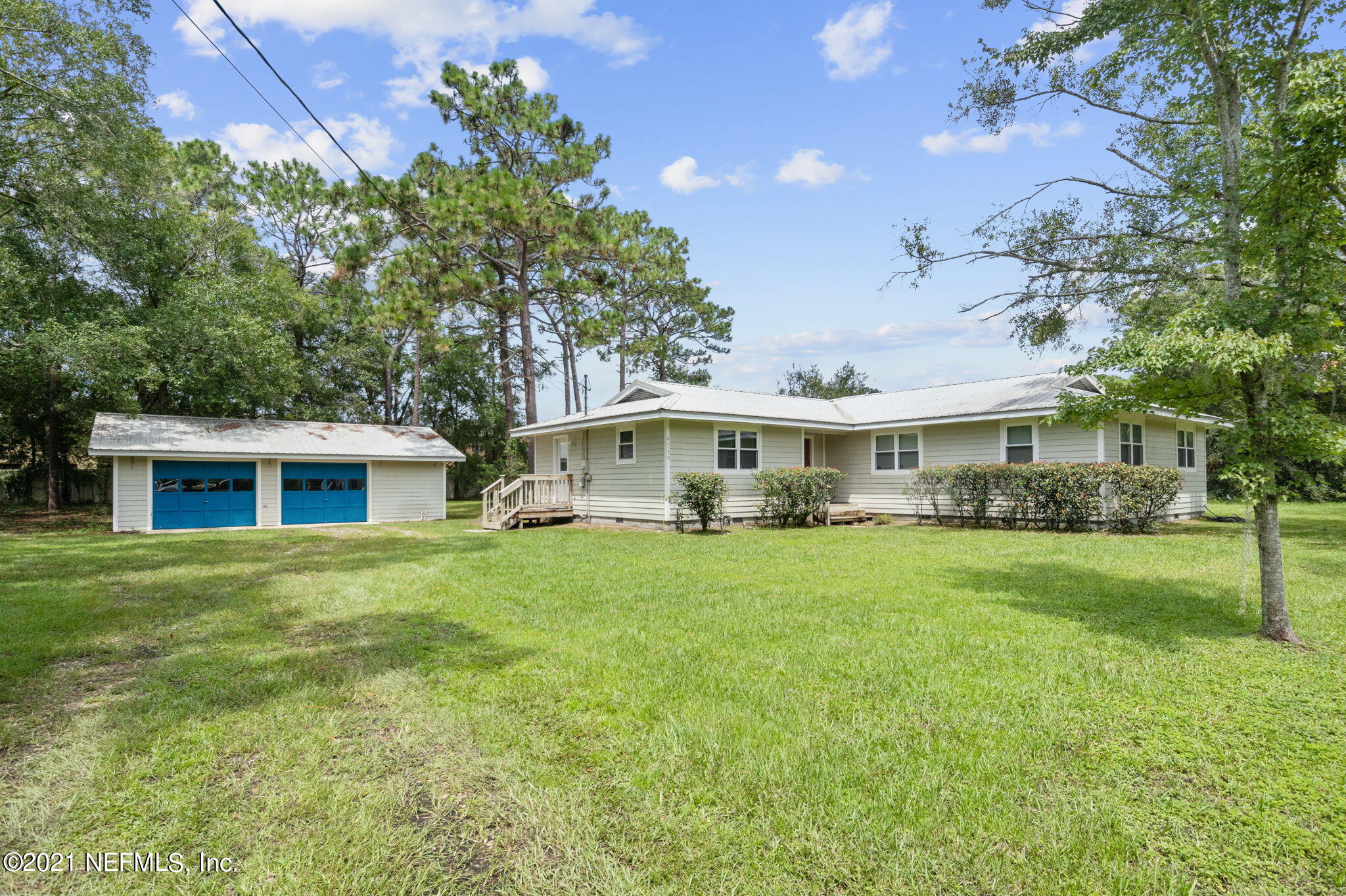 4730 Ricker Road Jacksonville, FL 32210 - Photo 1 of 30 a front view of a house with a garden