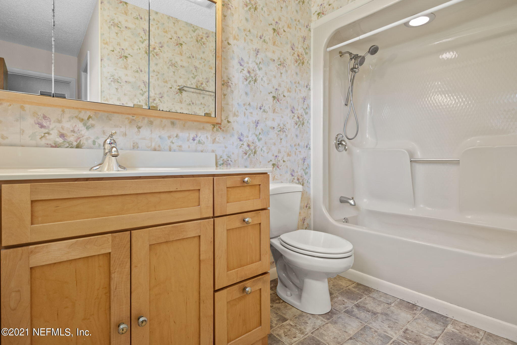4730 Ricker Road Jacksonville, FL 32210 - Photo 18 of 30 a bathroom with a sink a toilet and shower