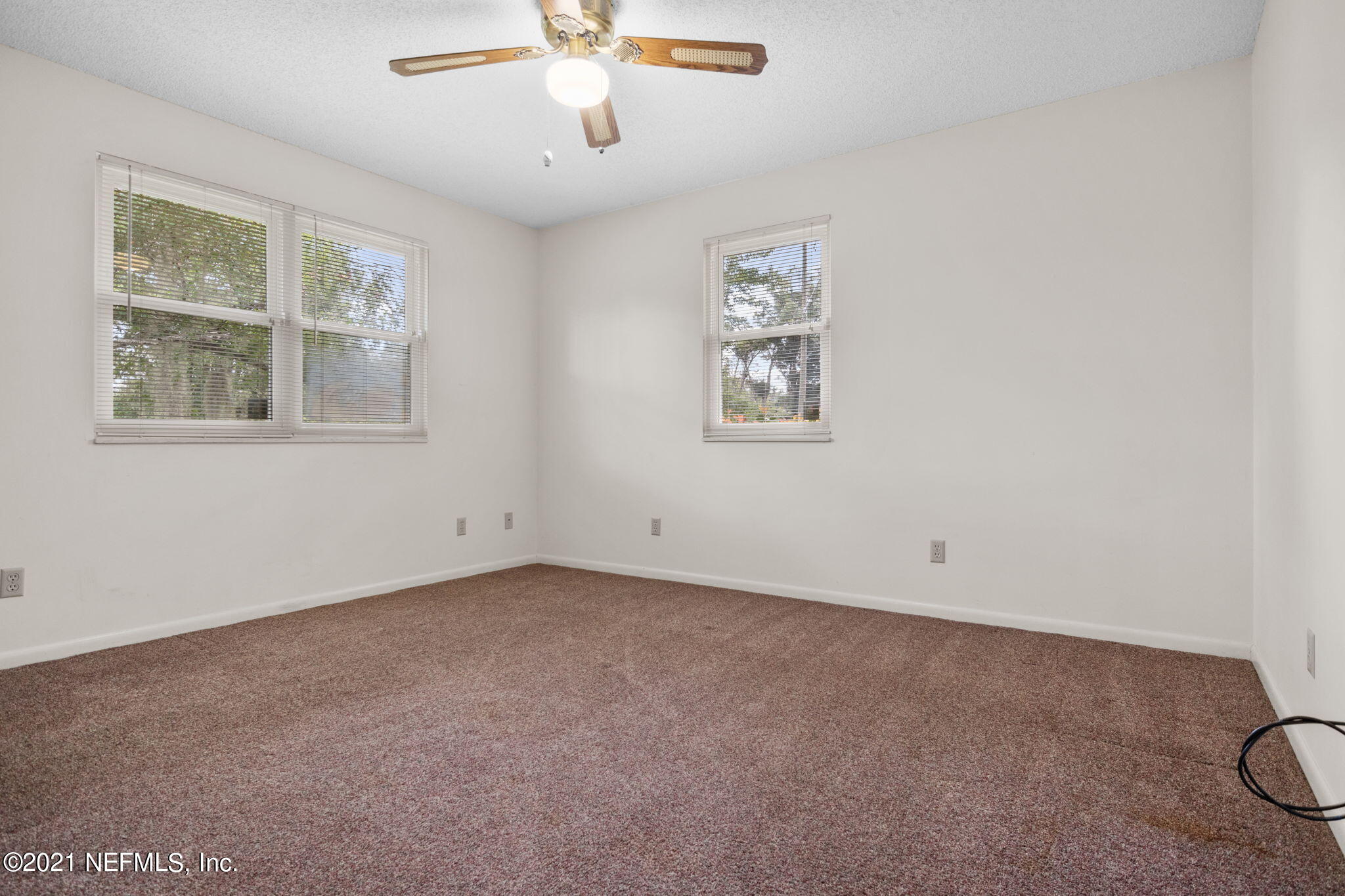 4730 Ricker Road Jacksonville, FL 32210 - Photo 21 of 30 a view of an empty room with a window