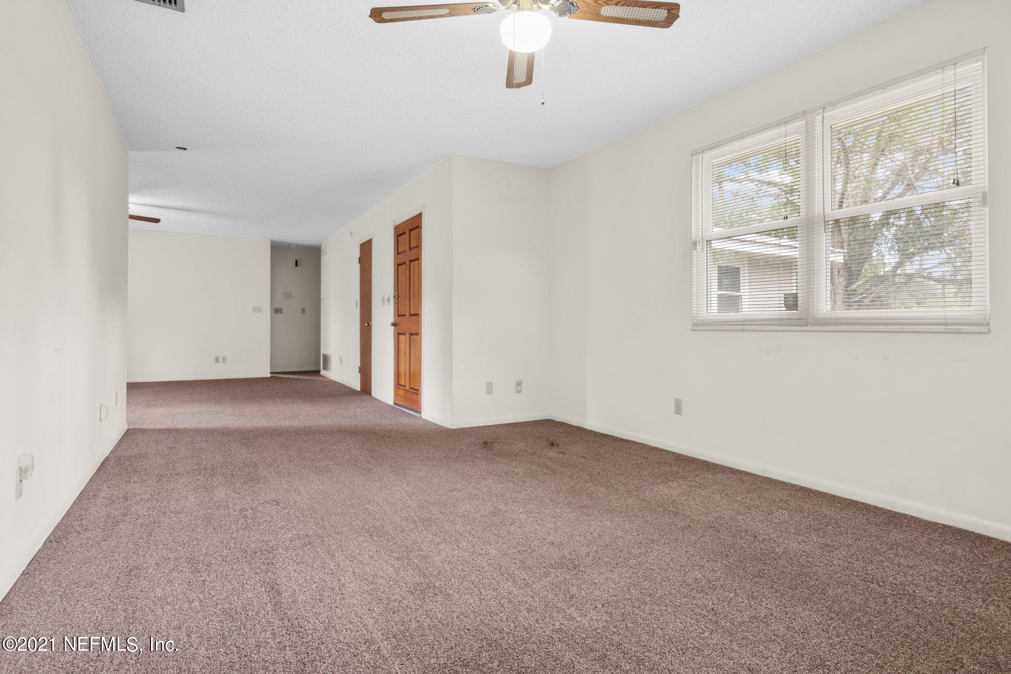 4730 Ricker Road Jacksonville, FL 32210 - Photo 24 of 30 an empty room with windows