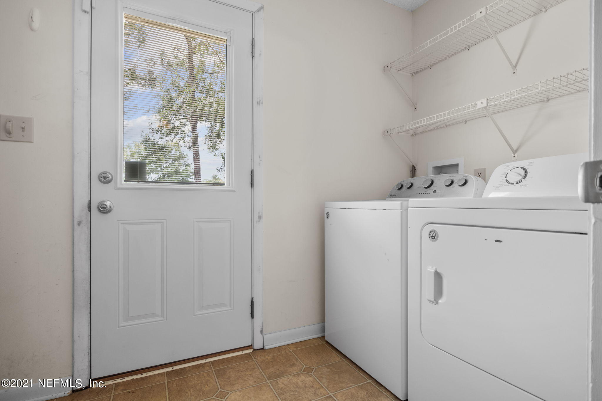 4730 Ricker Road Jacksonville, FL 32210 - Photo 27 of 30 a utility room with dryer and washer