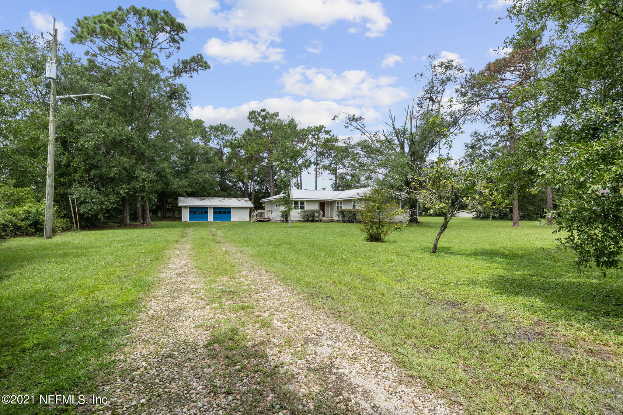 4730 Ricker Road Jacksonville, FL 32210 - Photo 5 of 30 a view of a house with a backyard