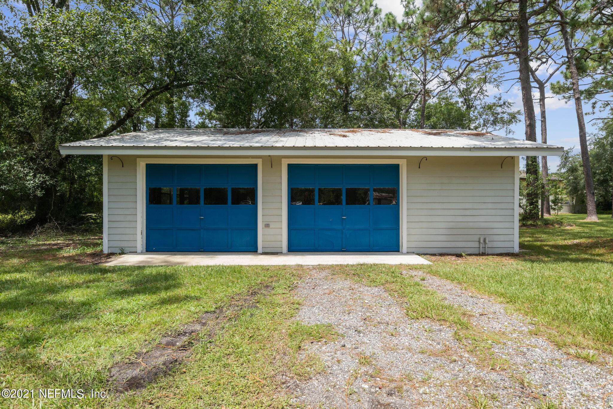 4730 Ricker Road Jacksonville, FL 32210 - Photo 7 of 30 a front view of a house with a yard