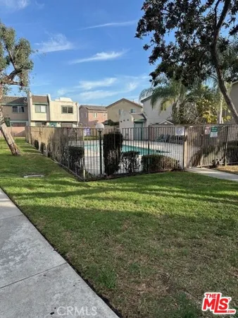 a view of a front of a house with a yard