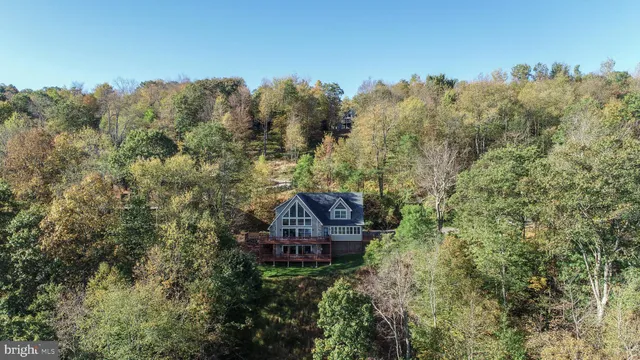a view of a house with a mountain in the background