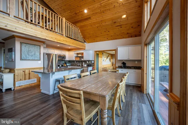 a room with furniture and pool table