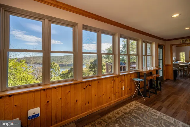 a bedroom with a bed and a flat screen tv in it