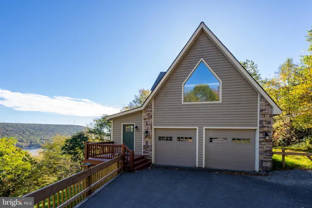 a bathroom with a bathtub toilet sink vanity and shower